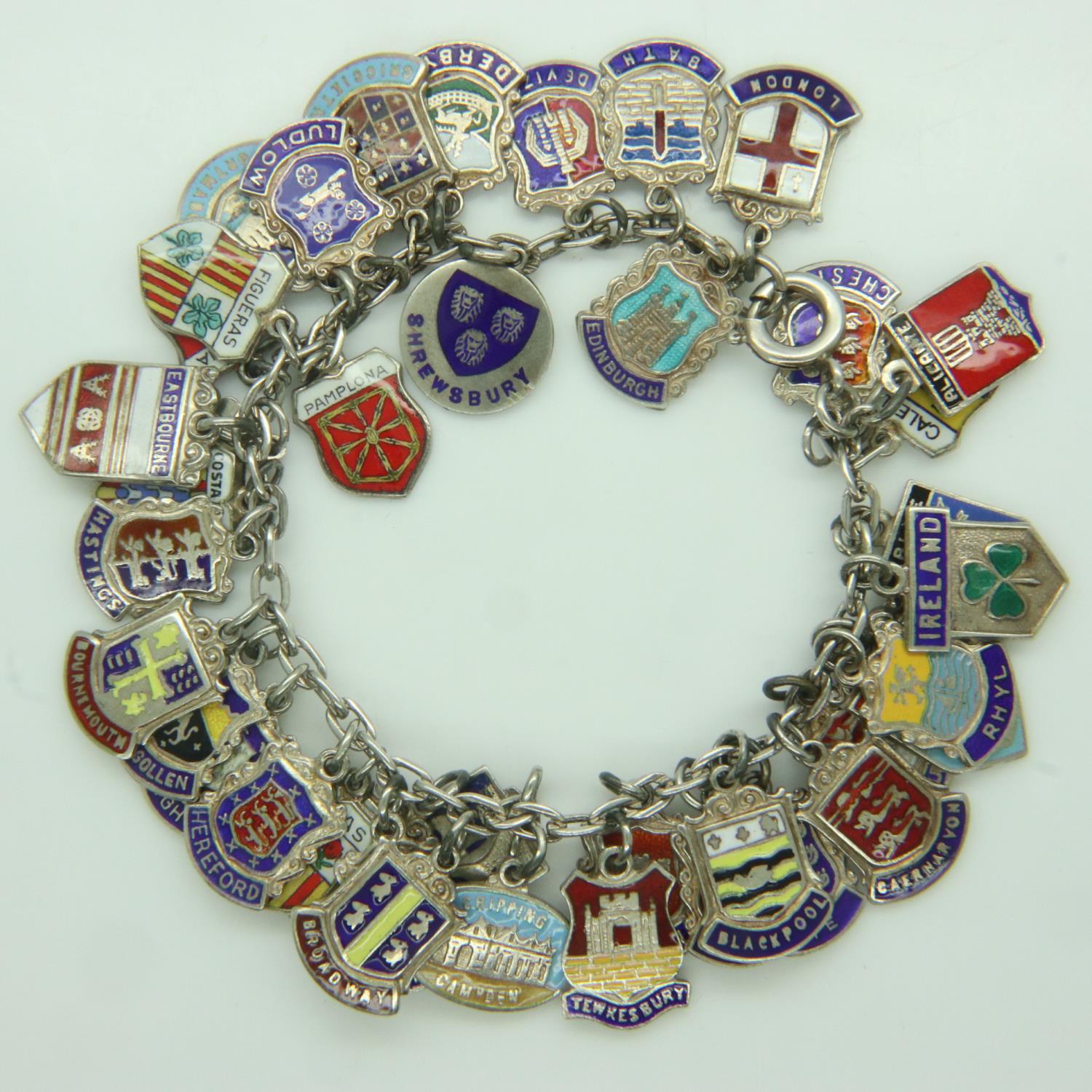 Silver charm bracelet with forty charms, 60g. UK P&P Group 1 (£16+VAT for the first lot and £2+VAT