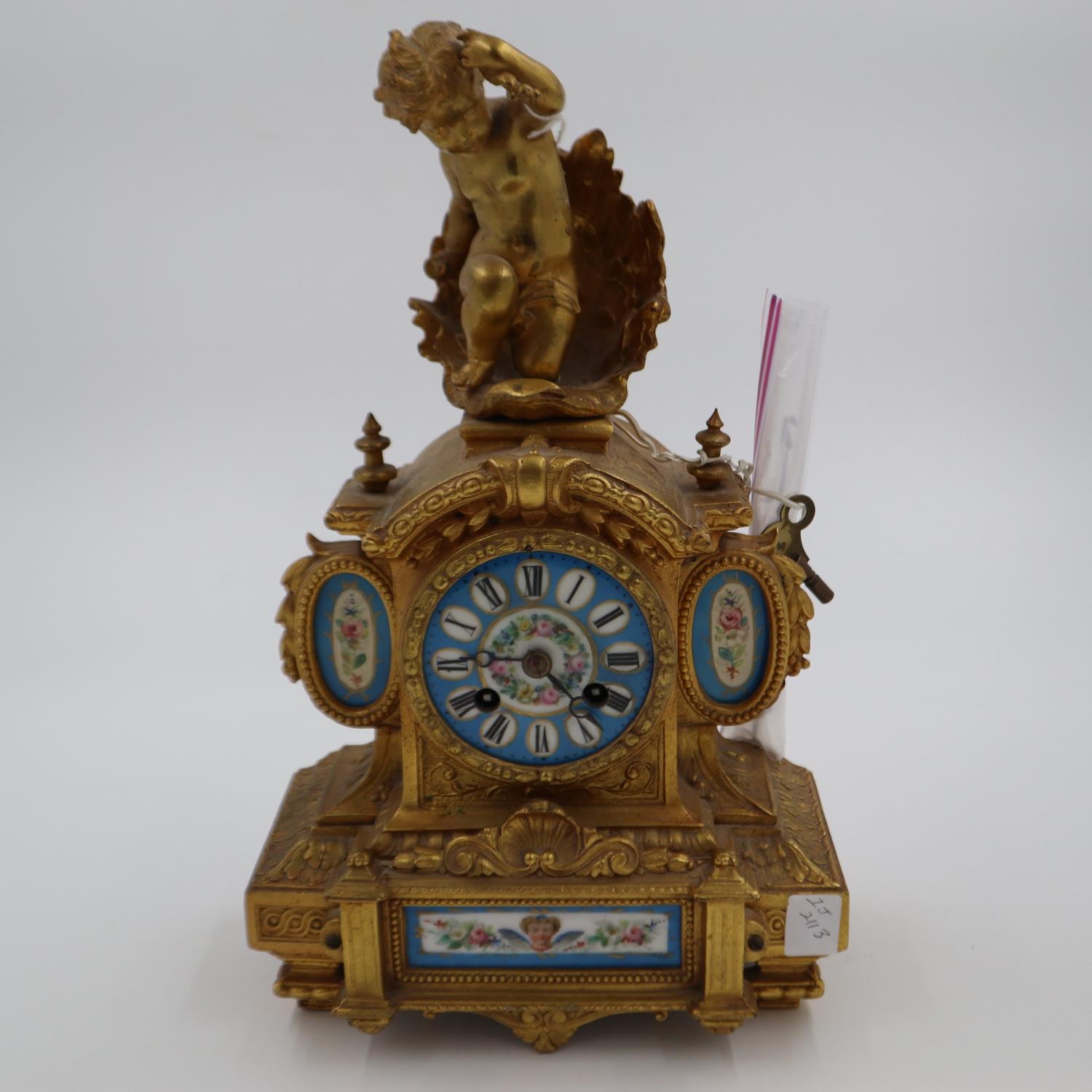 19th century figural gilt mantel clock with blue enamelled porcelain face and panels, decorated with