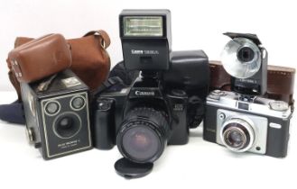 Collection of film cameras including Canon EOS 1000F with 35 to 80mm lens. UK P&P Group 3 (£30+VAT