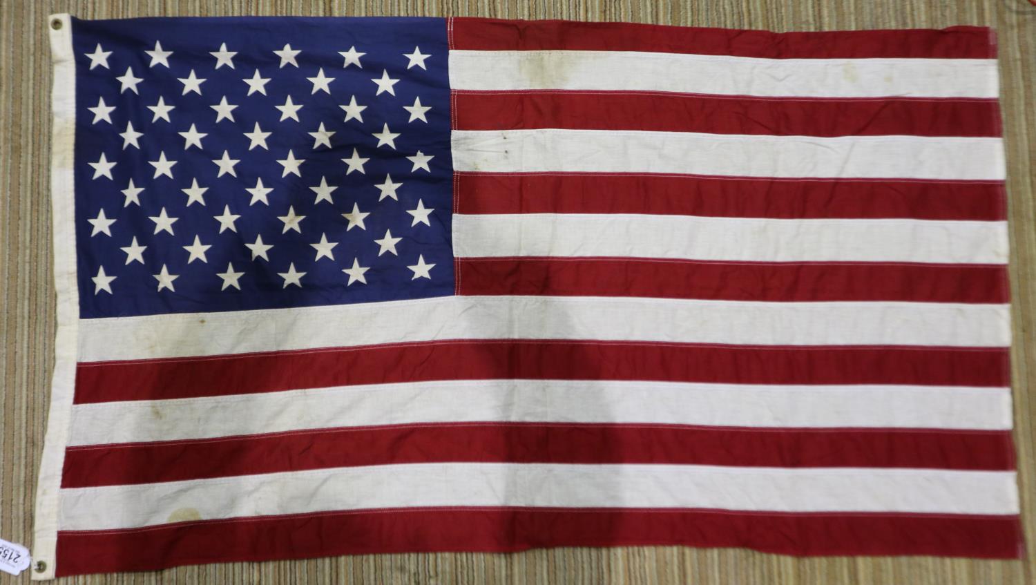 An American 20th century cotton flag, of printed and multi-piece construction, 130 x 80 cm. UK P&P