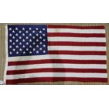 An American 20th century cotton flag, of printed and multi-piece construction, 130 x 80 cm. UK P&P