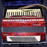 Clansman accordion in red within a fitted case. UK P&P Group 3 (£30+VAT for the first lot and £8+VAT