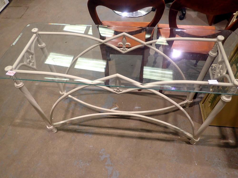 Glass top table on a metal frame, 70 x 46 x 122 cm. Not available for in-house P&P