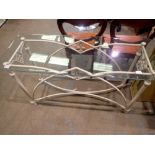 Glass top table on a metal frame, 70 x 46 x 122 cm. Not available for in-house P&P