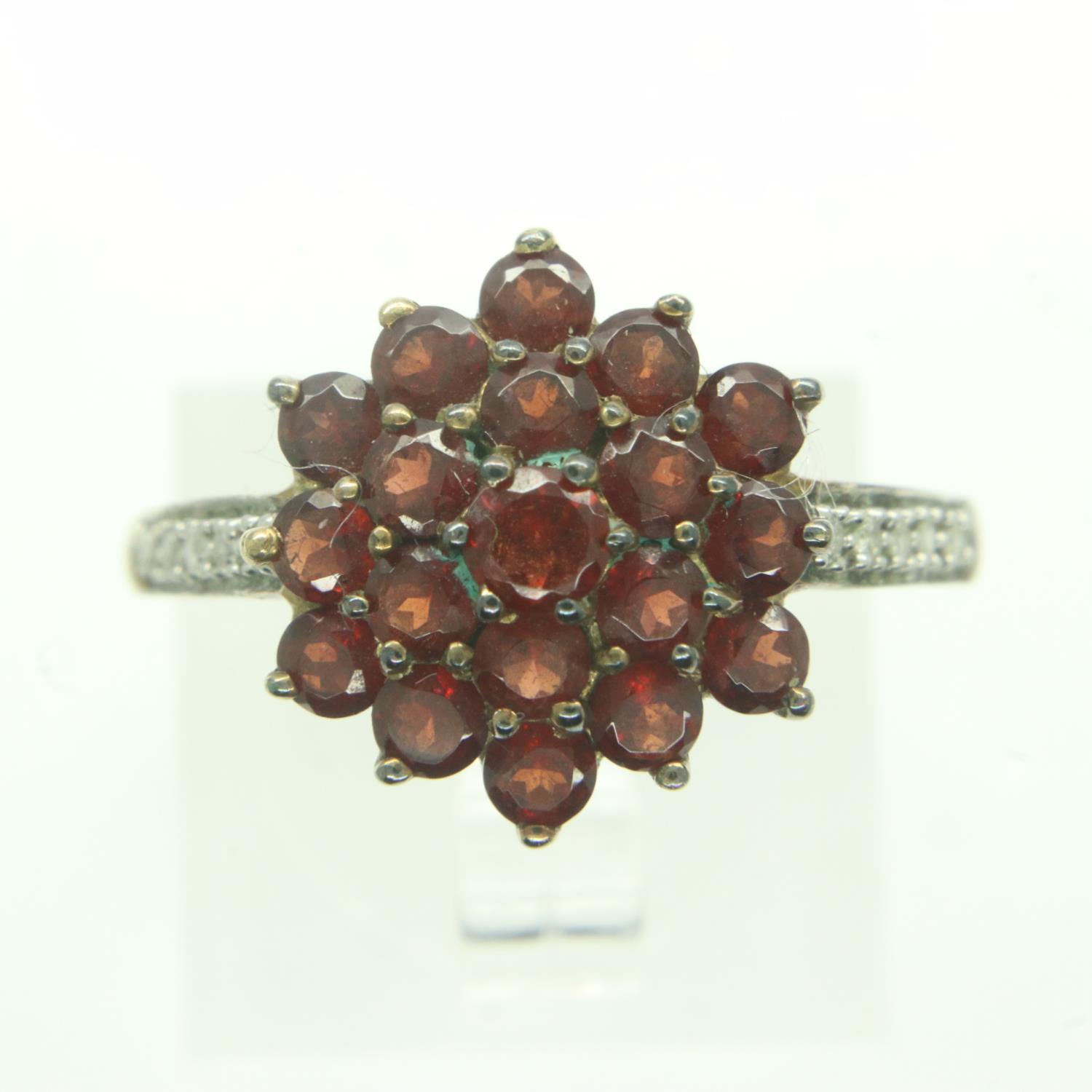 9ct gold cluster ring set with red stones and diamonds, size P, 2.9g. UK P&P Group 0 (£6+VAT for the