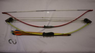 Two bows, Barnett Lil’Banshee child’s compound bow, quiver, 6 arrows and a child’s recurve bow.