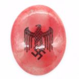 German WWII ceramic oval Swastika plaque, H: 70 mm. UK P&P Group 1 (£16+VAT for the first lot and £