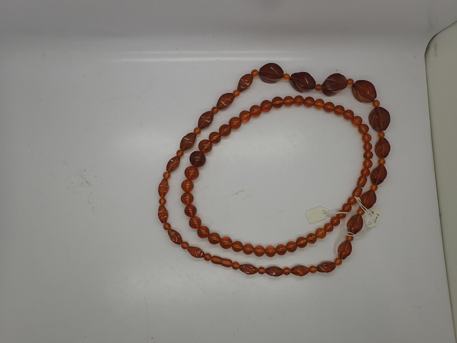 Two amber necklaces. UK P&P Group 1 (£16+VAT for the first lot and £2+VAT for subsequent lots)