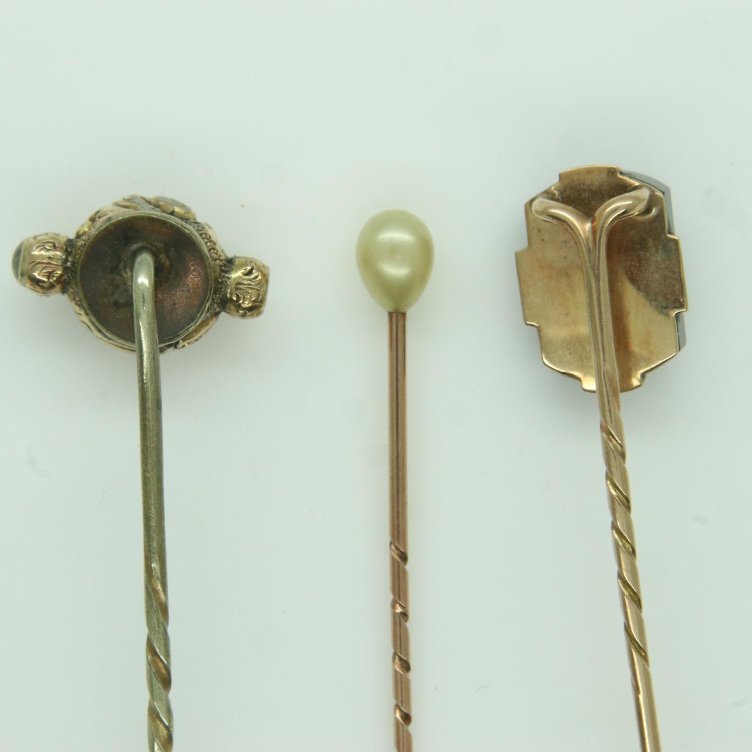 Three antique gold stick pins, set with pearl, onyx and chalcedony, 5.3g. UK P&P Group 0 (£6+VAT for - Image 2 of 2