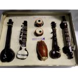 Seven Indian miniature wooden instruments, Largest L: 17 cm. Not available for in-house P&P