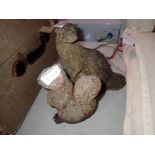 Two garden ornaments to include a stone ferret and squirrel. Not available for in-house P&P