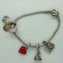 Pandora Disney bracelet with five Disney charms, with box and bag, L: 18 cm. UK P&P Group 1 (£16+VAT