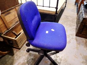 Black plastic and metal hydraulic office chair with blue upholstery on casters. Not available for