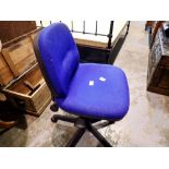 Black plastic and metal hydraulic office chair with blue upholstery on casters. Not available for