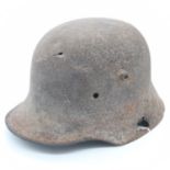 WWI Battle Damaged German M16 Stahlhelm Helmet. This helmet was found in woodland in the Ypres