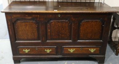 An 18th century oak dower chest, panelled and with two lower cross-banded drawers, 148 x 55 x 83