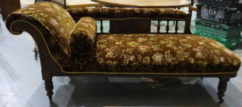 Victorian oak framed chaise lounge with four turned supports and scrolling rest, L: 180 cm. Not