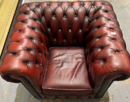 Chesterfield club chair, in the blood red colourway, H 75 x D 90 x W 109 cm. Not available for in-