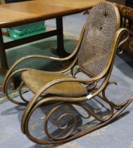 1920s French bent wood rocking chair with bergair back rest for restoration. Not available for in-
