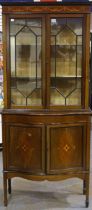 Edwardian inlaid walnut display cabinet with two astragal glazed doors above two cupboard doors,