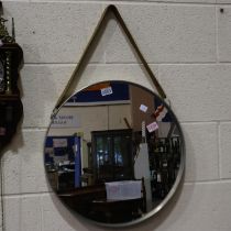 John Lewis circular mirror, suspends from a wide leather strap, D: 52cm. Not available for in-