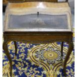 A 19th century French paquetry inlaid kingwood bonheur-du-jour, with drop-front decorated with a