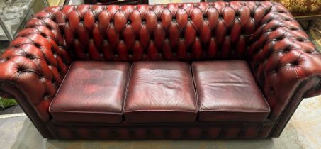 Chesterfield three seat sofa, in the blood red colourway, H 75 x D 90 x W 200 cm. Not available for
