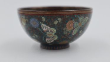 A late 19th / early 20th century Chinese cloisonne enamelled tea bowl, the body profusely