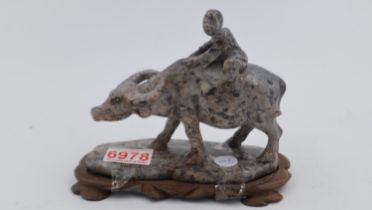 Oriental buffalo figure on a wooden base, L: 18 cm. UK P&P Group 2 (£20+VAT for the first lot and £