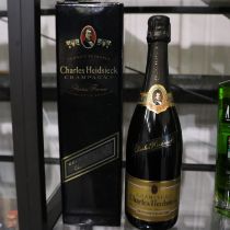 Cased bottle of Charles Heidsieck champagne. Not available for in-house P&P