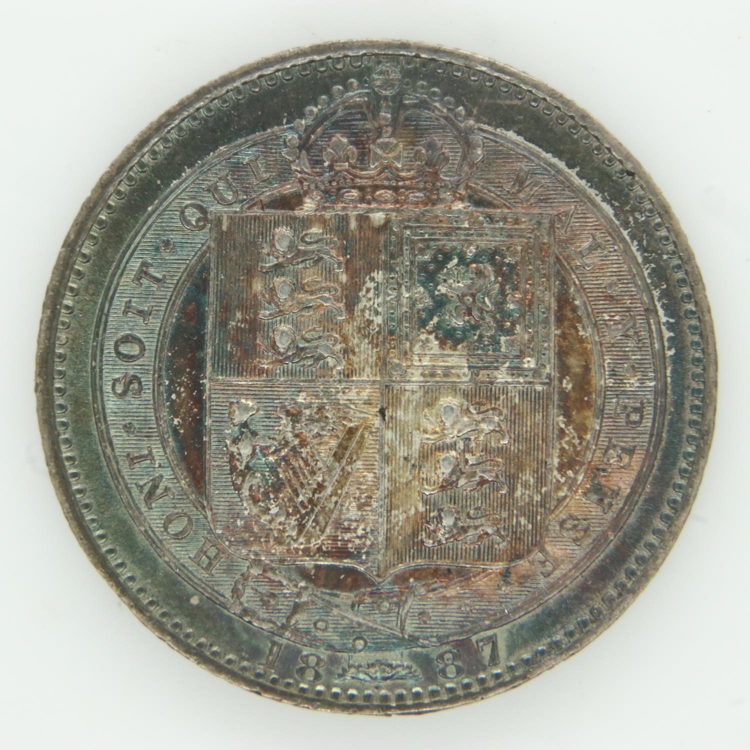 Boxed 1887 silver shilling EF grade with iridescent toning. UK P&P Group 1 (£16+VAT for the first