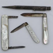 Two hallmarked silver fruit knives with mother of pearl handles together with another and a sterling