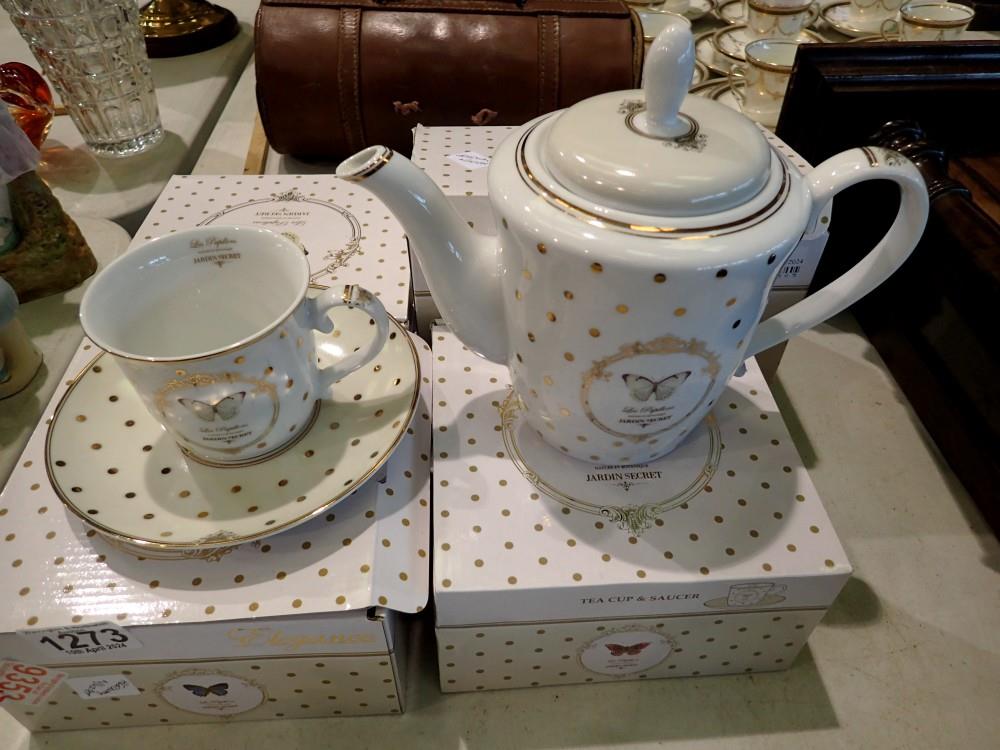 Three boxed Wedgwood Elegance tea cups and saucers and a matching teapot. Not available for in-house