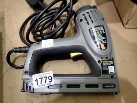 Stanley electric staple gun, #0-TRE550. All electrical items in this lot have been PAT tested for