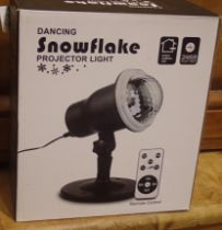 New old stock dancing snowflake projector light for outdoor and indoor use with remote, boxed,