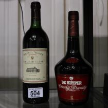 Bottle of oak aged claret and a bottle of cherry brandy. Not available for in-house P&P