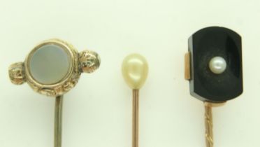 Three antique gold stick pins, set with pearl, onyx and chalcedony, 5.3g. UK P&P Group 0 (£6+VAT for