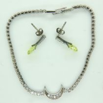 Silver peridot set earrings and white metal stone set bracelet, L: 16 cm. UK P&P Group 1 (£16+VAT