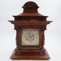Large Junghans oak cased mantel clock, with brass dial and silvered chapter ring, chiming on a gong,