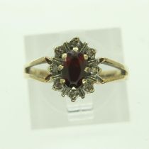 9ct gold ring set with garnet and diamonds, size K/L, 2.7g. UK P&P Group 0 (£6+VAT for the first lot