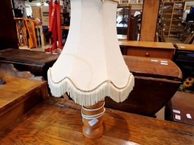 Wooden turned lamp with shade. All electrical items in this lot have been PAT tested for safety