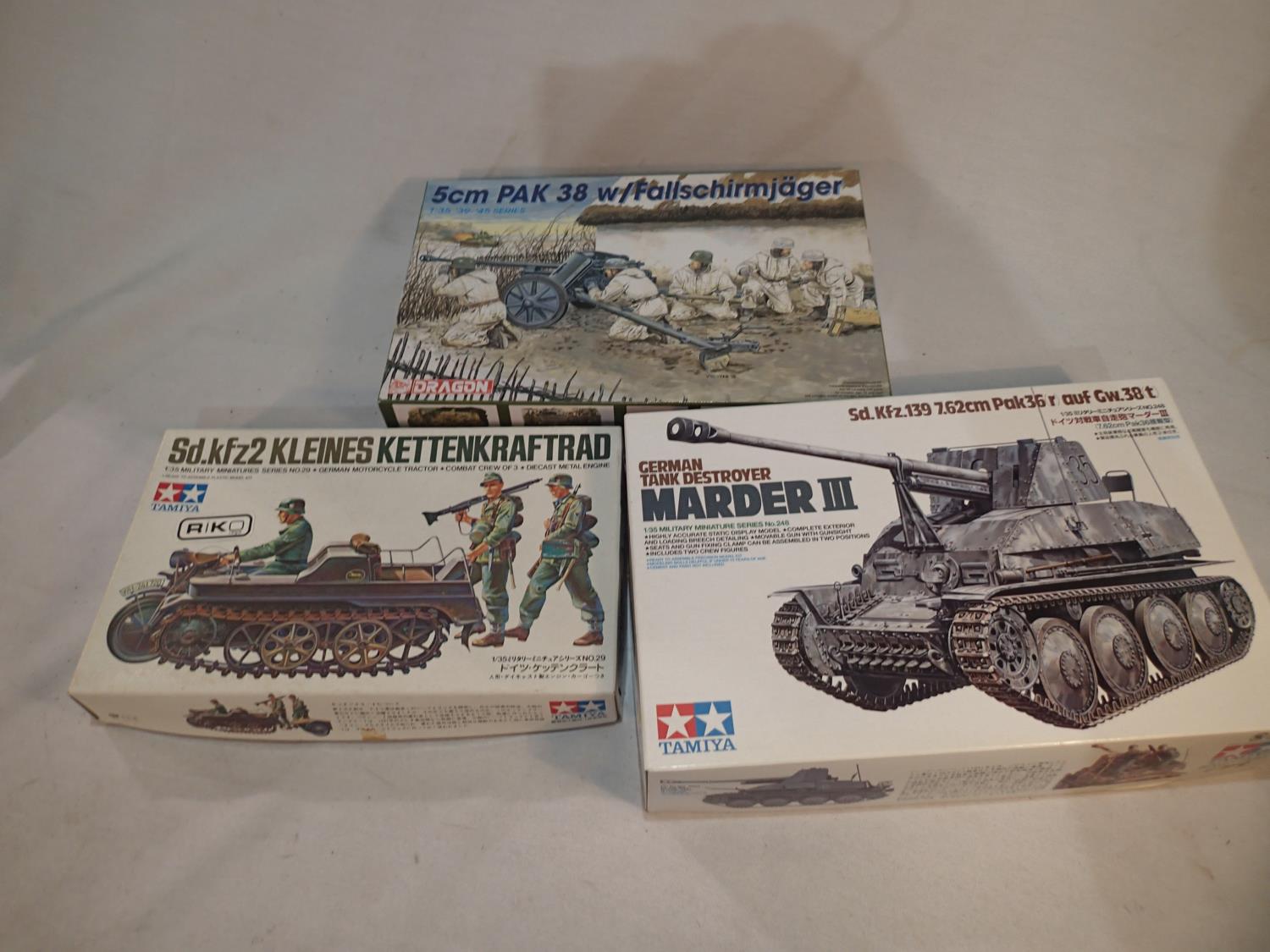 Three 1/35 scale military related kits, Tamiya Marder III tank destroyer, Tamiya Kettenkraftrad, and