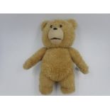 Ted from the movie Ted. Battery opereted, batteries required. Approx. 40cm (H). UK P&P Group 3 (£