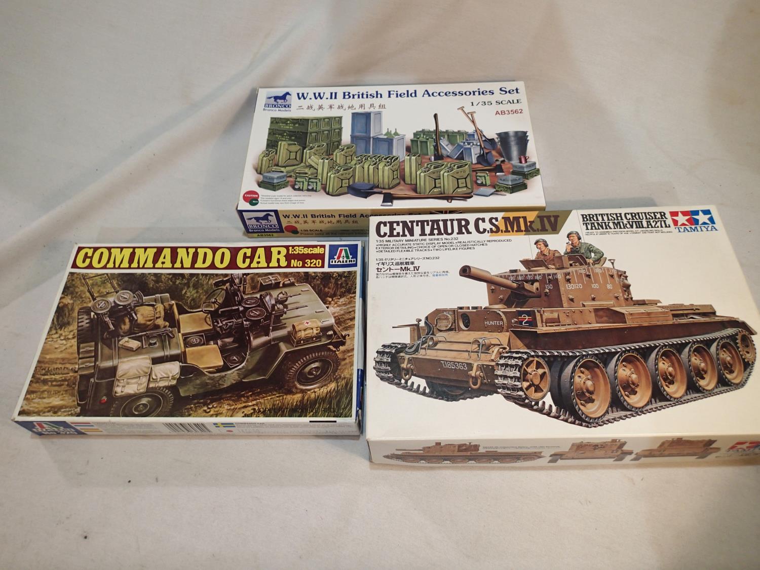 Three 1/35 scale military related kits, Tamiya Centaur cruiser tank, Italeri commando car, and