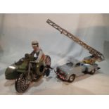 Two tinplate clockwork vehicles, Gama rescue truck with extending ladder and bell, 24cm, and Xonex