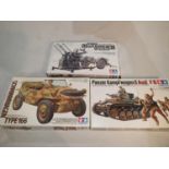 Three 1/35 scale military related kits by Tamiya, 20 mm Flakvierling, Schwimmwagen, Panzer