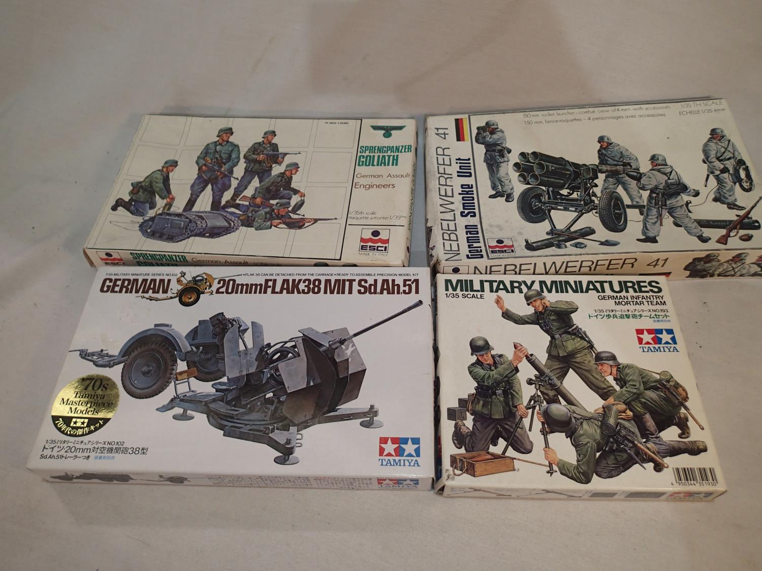 Four 1/35 scale military related kits, Esci Sprengpanzer Goliath and engines, Esci German smoke