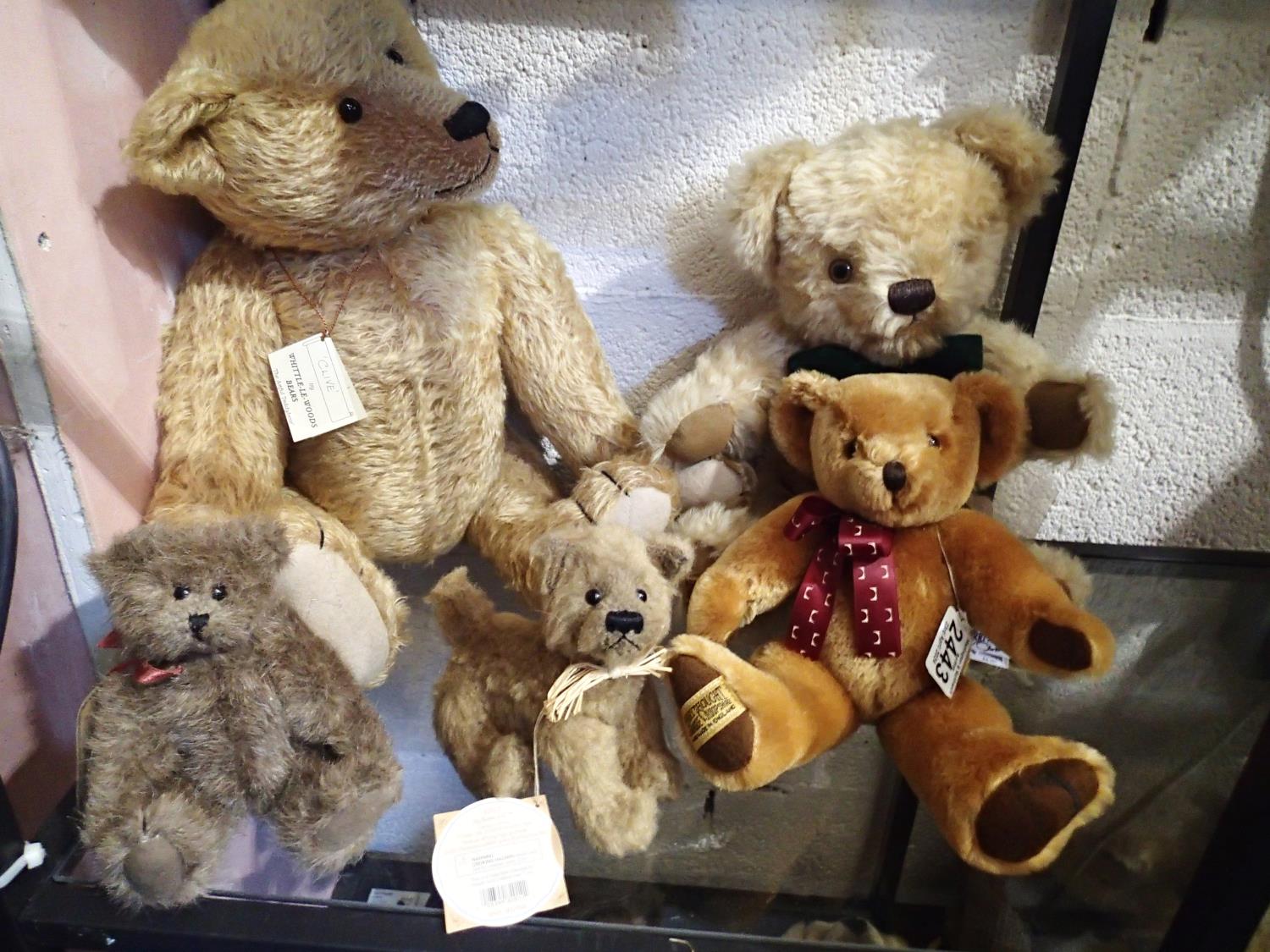 Five mixed teddy bears, including a Merrythought The Ironbridge Year Bear 2007, with tags and a