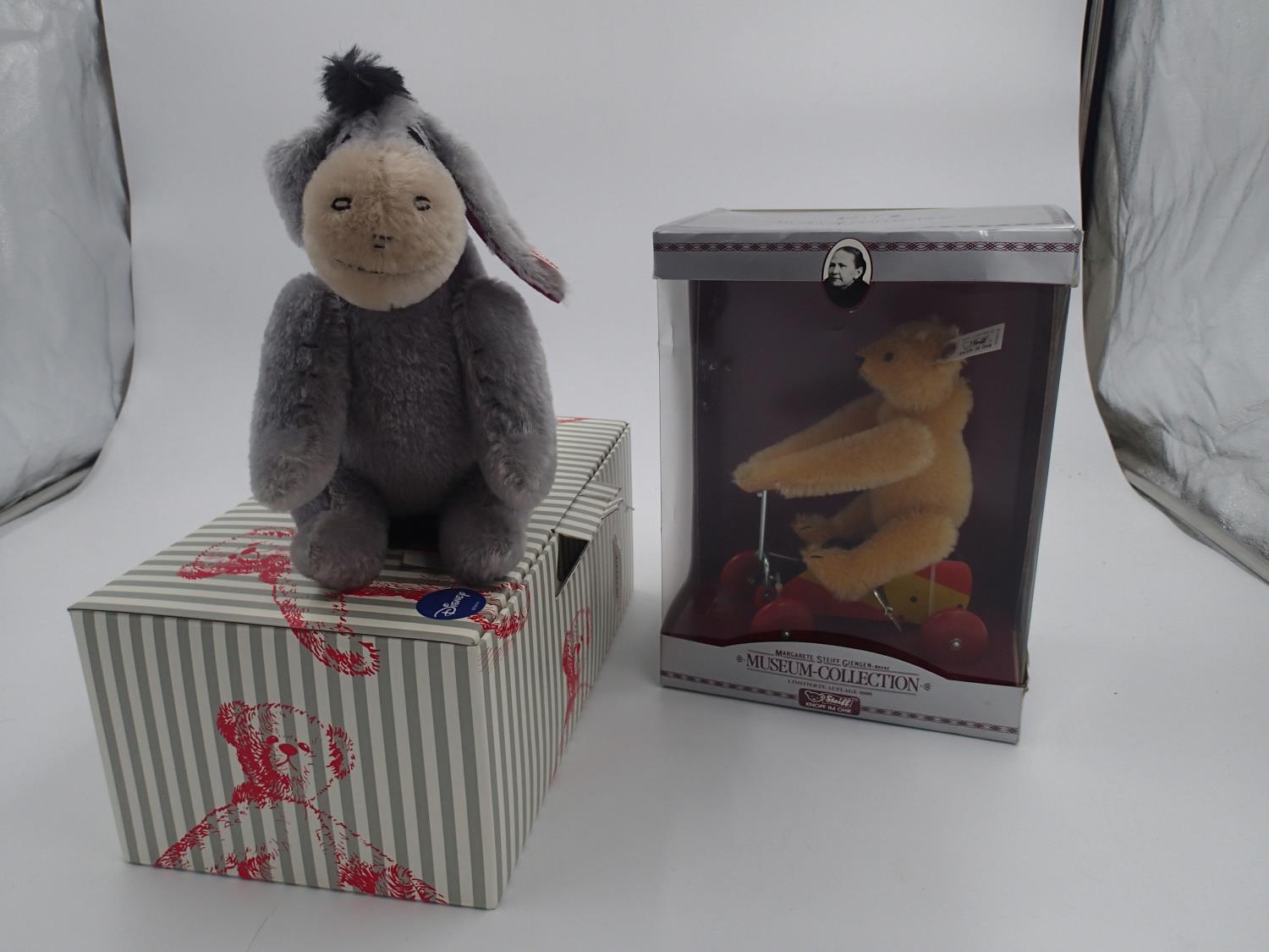 Two Steiff, a Mini Eyore, 683541 and a clockwork UR-Teddy 1926, 400919, both boxed with tags. UK P&P