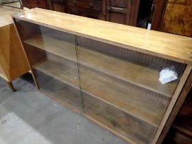 Teak bookcase, with glass sliding doors, 75 x 114cm L. Not available for in-house P&P